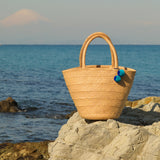 'Nanci' パームヤシ使用 ポンポン付き バッグ - ペルー人アーティストハンドメイド